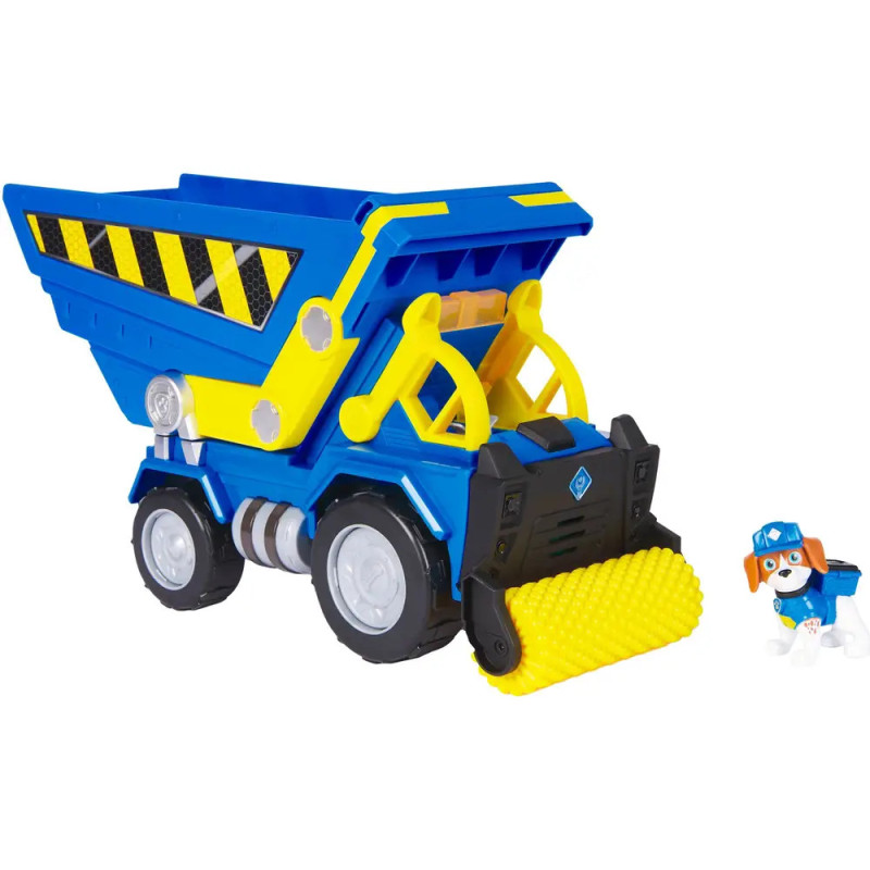 Blauer und gelber Spielzeugkipper neben kleinem Hund als Bauarbeiter.