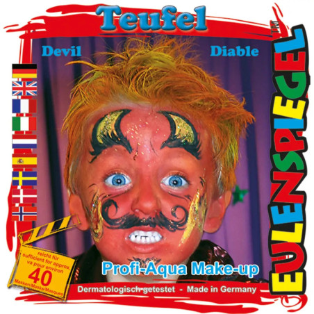 Kind mit buntem Teufelsgesicht, gelben Haaren und weit offenen Augen auf Eulenspiegel-Schminkpackung.