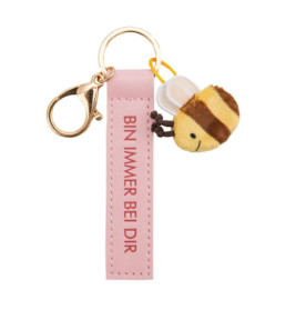 Pinker Schlüsselanhänger mit BIN IMMER BEI DIR und einem kleinen Plüschbienen-Anhänger.