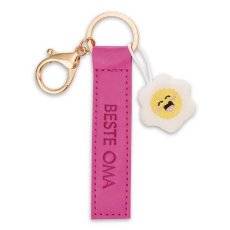 Pinker Schlüsselanhänger mit Aufschrift BESTE OMA und kleinem, lächelndem Blümchen-Anhänger.