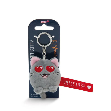 Grauer Plüsch-Katzenanhänger mit Herzaugen an Verpackung ALLES LIEBE! und rotem Etikett.