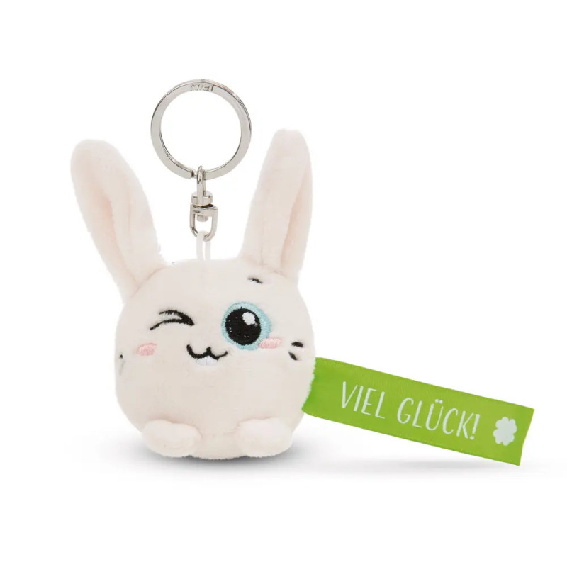 Plüschhasen-Schlüsselanhänger zwinkert, grünes Schild mit Viel Glück! und Kleeblatt.