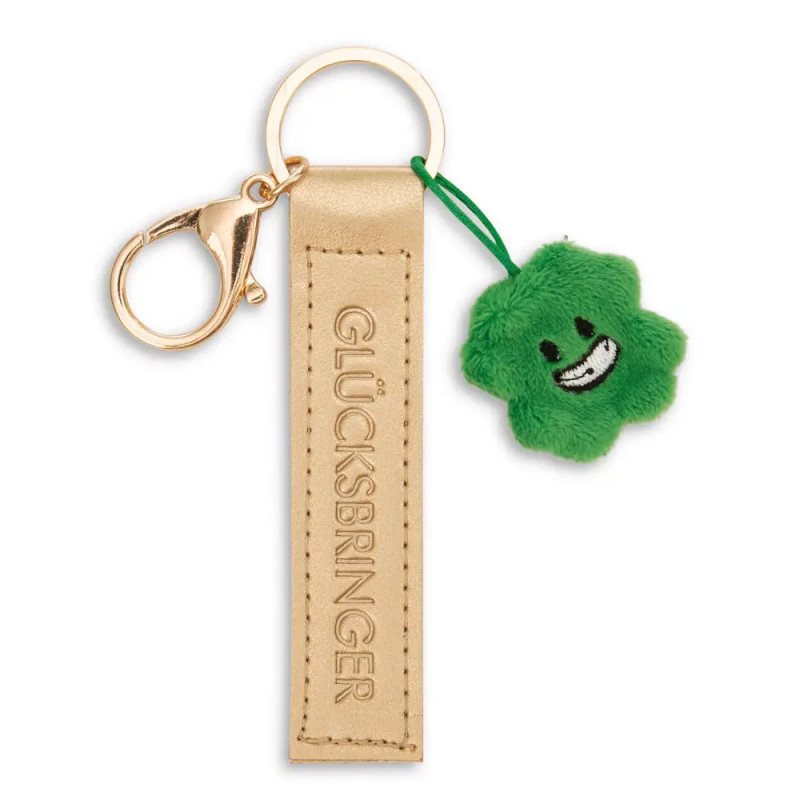Goldener Glücksbringer-Schlüsselanhänger mit grünem Plüsch-Vierblattklee und lachendem Gesicht.