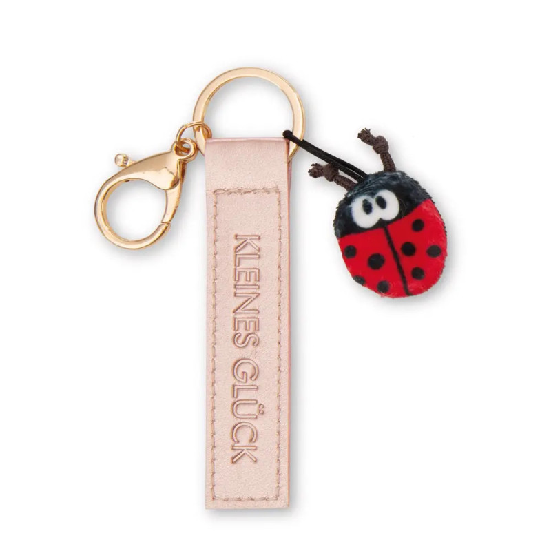 Rosa Schlüsselanhänger mit der Aufschrift KLENES GLÜCK und kleinem Plüsch-Marienkäfer.