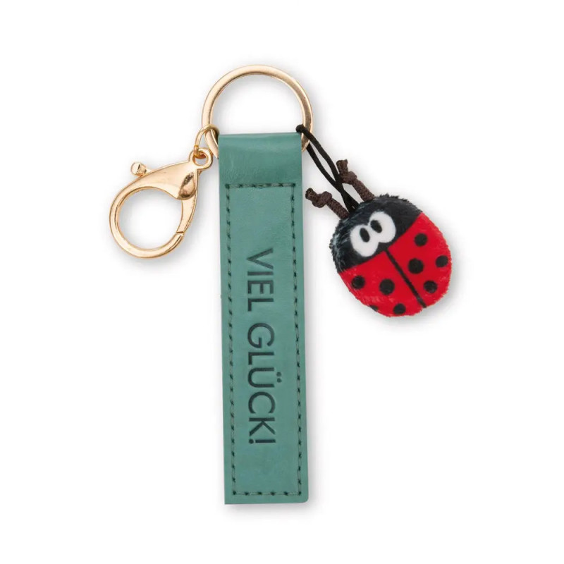 Grüner Schlüsselanhänger mit VIEL GLÜCK! und kleinem Marienkäfer-Anhänger.