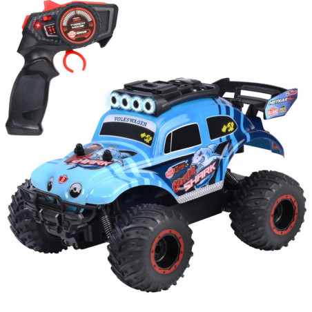 Blauer RC-Monstertruck mit großen Reifen und Haifischdekor, daneben die schwarze Fernbedienung.