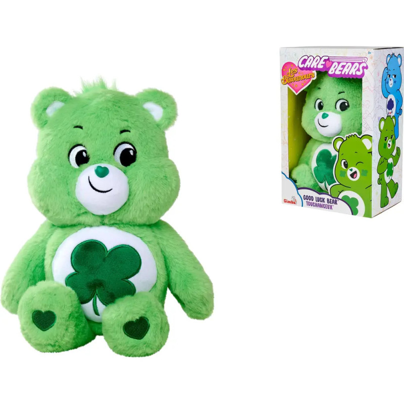 Grüner Care Bear mit Kleeblatt auf dem Bauch neben seiner Verpackung.