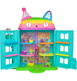 Buntes, katzenförmiges Puppenhaus mit mehreren Zimmern, Möbelstücken und einer Puppe innen.