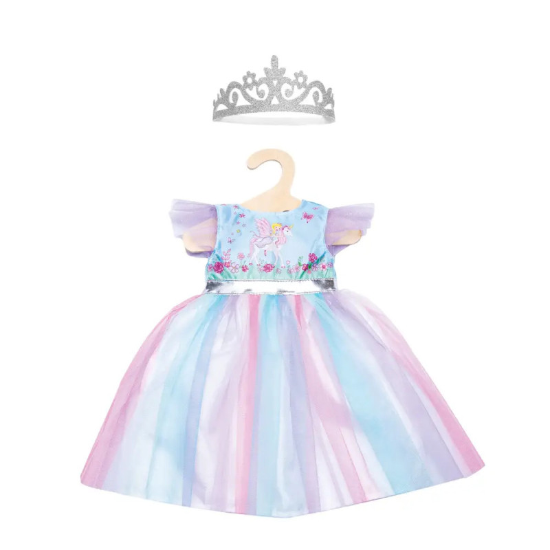 Pastellfarbenes Prinzessinnenkleid mit Einhornmotiv und silberner Tiara auf einem Bügel. Pastellfarbenes Prinzessinnenkleid mit Einhornmotiv und silberner Tiara auf einem Bügel.