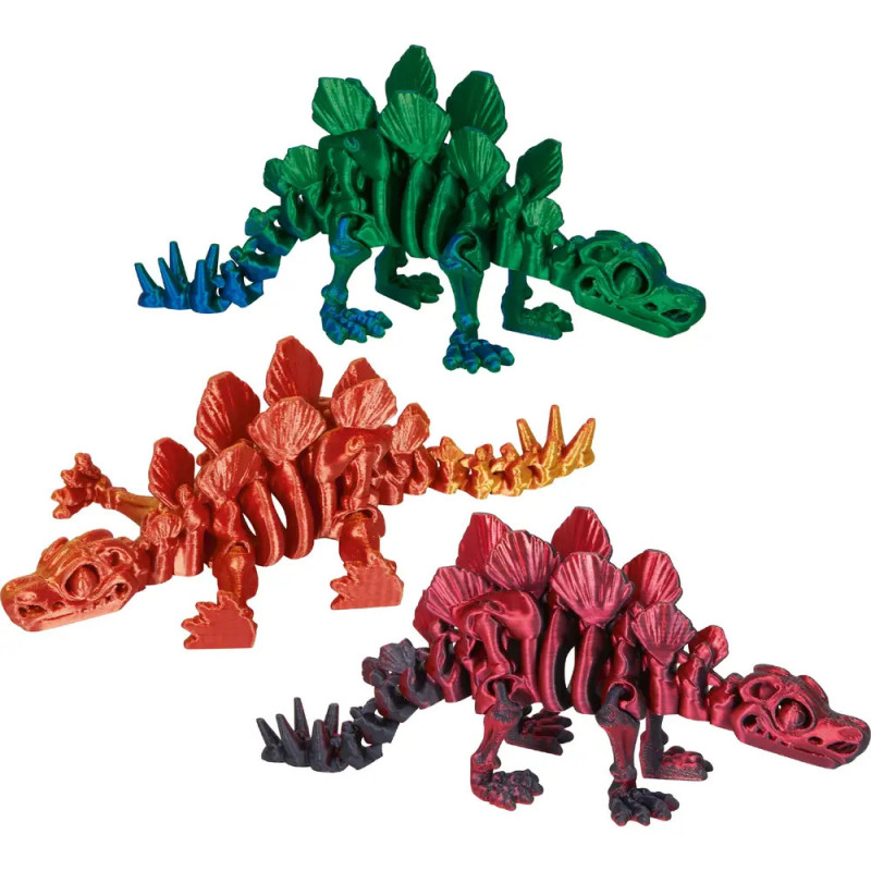 Drei bunte Stegosaurus-Spielzeuge in Grün, Orange und Rot mit markanten Rückenschildern.