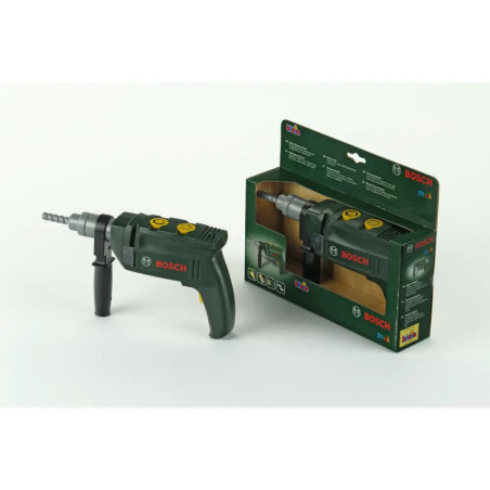 Ein Bosch-Spielzeugbohrer steht neben seiner grünen Verpackung auf weißem Hintergrund.