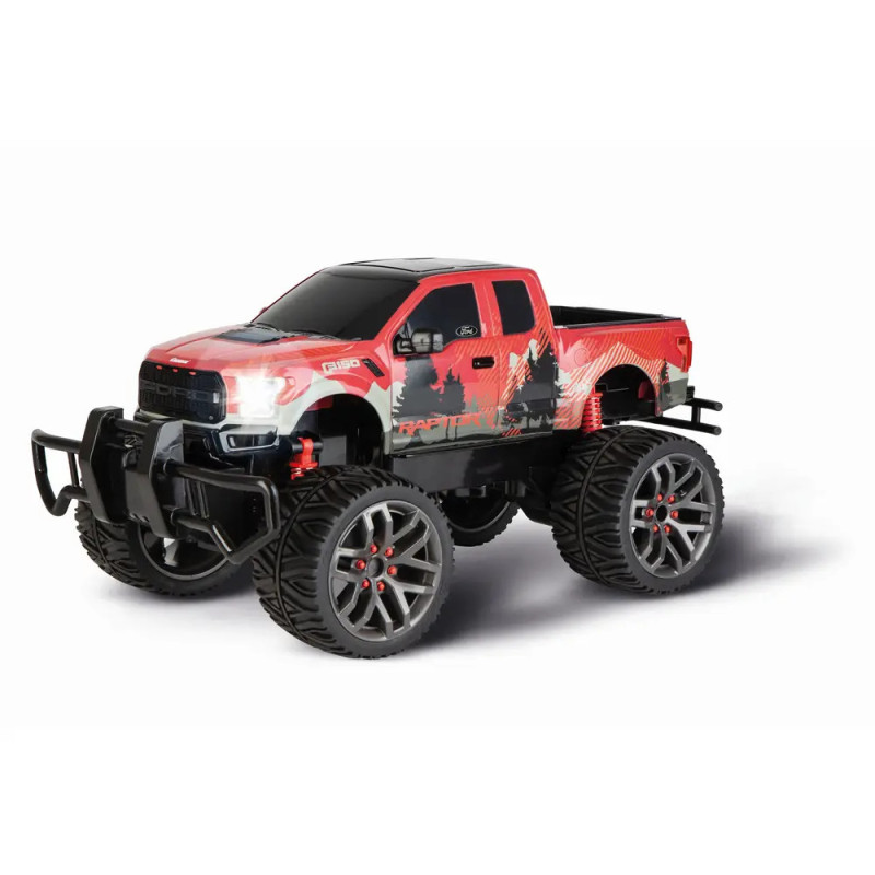 Roter und schwarzer Spielzeug-Monstertruck mit großen Reifen und robustem Design, aus schräger Frontansicht.