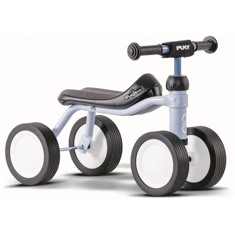 Kleines Laufrad für Kleinkinder mit vier Rädern, schwarzem Sitz, grauem Rahmen und schwarz-weißen Rädern.