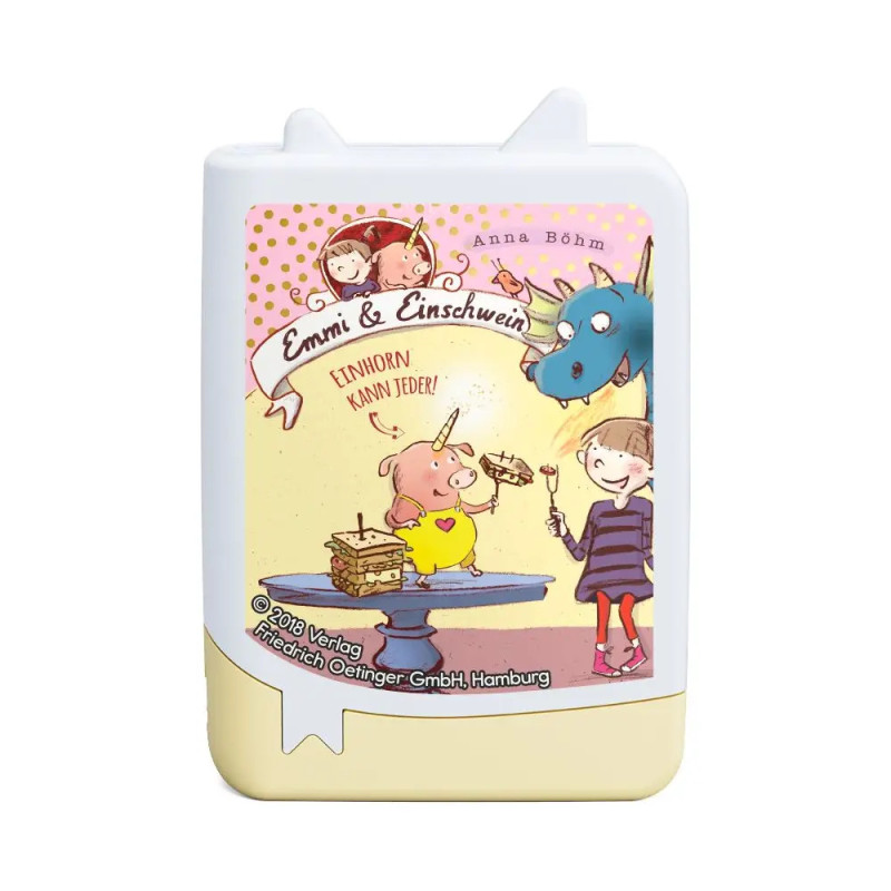 Ein Schwein mit Einhorn, ein Mädchen und ein blauer Drache essen gemeinsam Waffeln.