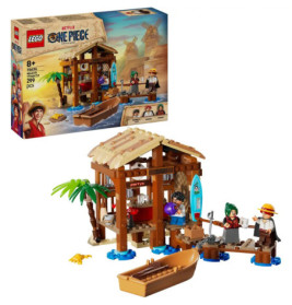 LEGO One Piece Set: Hütte, Boot, Palme und drei Minifiguren am Strand, Box im Hintergrund.