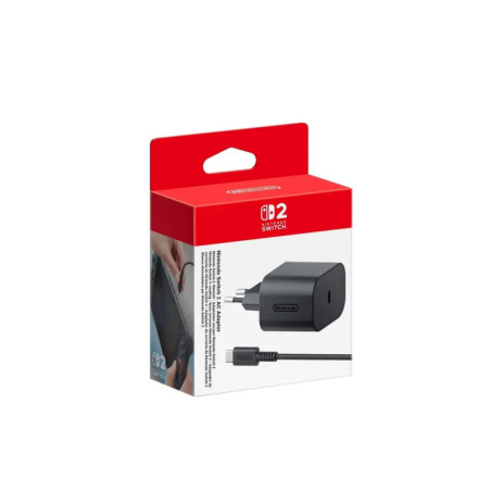Schwarzes Nintendo Switch Netzteil in rot-weißer Verpackung.