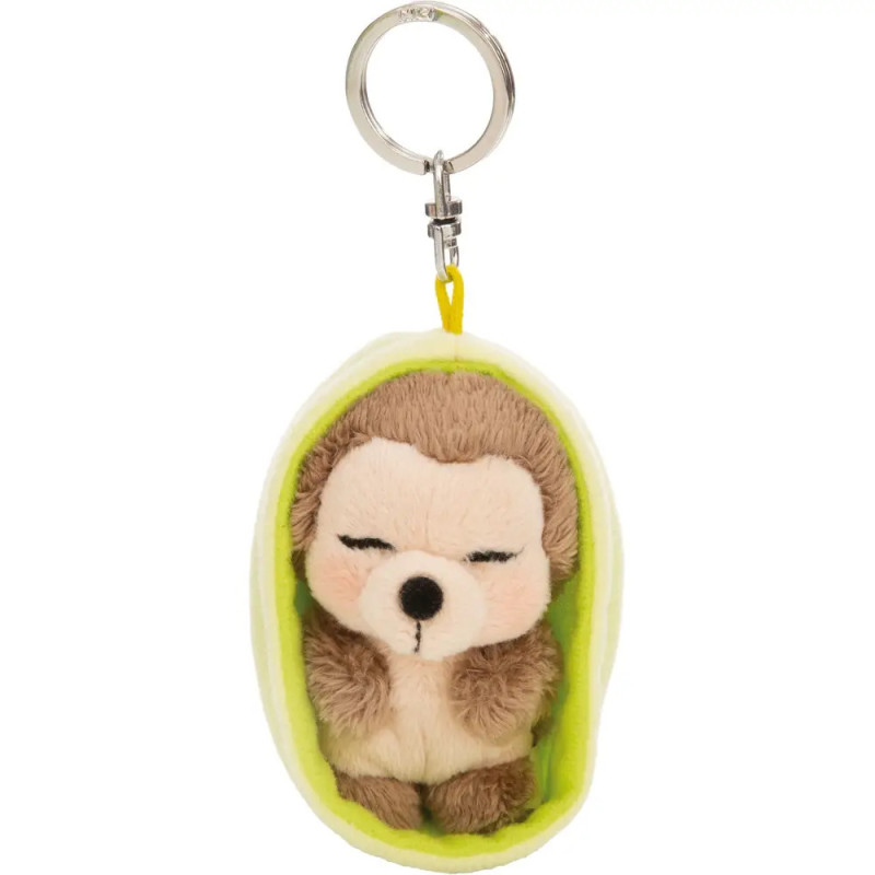 Schlüsselanhänger: Plüschfaultier schlafend in weicher, grüner Hülle in Erbsenschotenform.