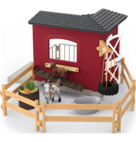 Spielzeug-Bauernhof mit Zaun, Ziege, Zicklein, Futtertrog, Eimer und Windmühle auf einer Seite.