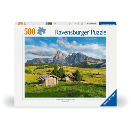Ravensburger Puzzle mit 500 Teilen: Berge, grüne Wiesen und Holzhütten unter blauem Himmel.