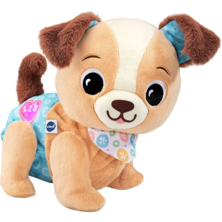 Plüschhund mit braun-cremem Fell, blauer Shorts und gemustertem Halstuch.