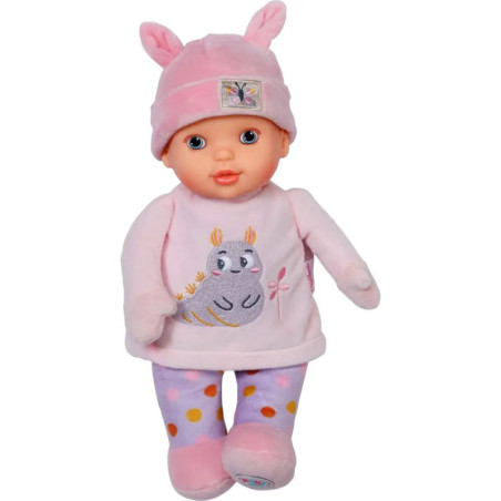 Babypuppe in rosa Kleidung, mit Mütze mit Hasenohren und gepunkteter Leggings.