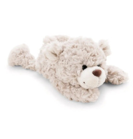 Ein flauschiges, hellbeiges Teddybär-Plüschtier liegt auf dem Bauch und hat ein niedliches, lächelndes Gesicht.