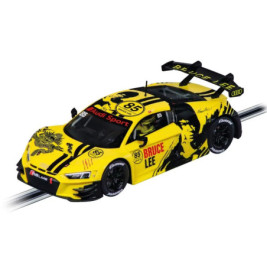 Gelber Audi-Rennwagen mit Drachen- und Bruce-Lee-Grafik, Nr. 85, fährt auf einer Slotcar-Bahn.