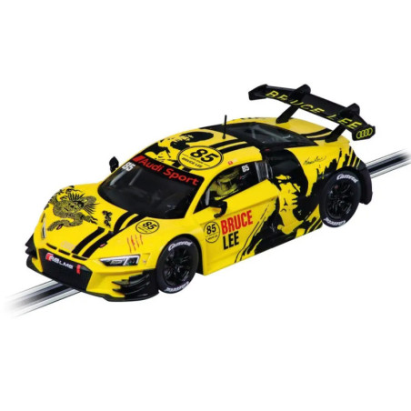 Gelber Audi-Rennwagen mit Drachen- und Bruce-Lee-Grafik, Nr. 85, fährt auf einer Slotcar-Bahn.
