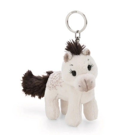 Plüsch-Pferdeschlüsselanhänger mit weißem Fell, dunkler Mähne und Schweif sowie gestickten Augen vor weißem Hintergrund.