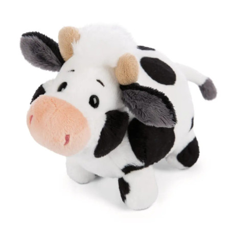 Stoffkuh mit schwarzen Flecken, rosa Schnauze, braunen Hörnern und weißer Schwanzspitze vor weißem Hintergrund.