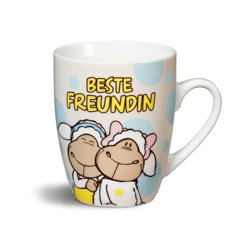 Tasse mit zwei umarmenden Schaf-Cartoons und gelbem BESTE FREUNDIN-Schriftzug auf Tupfen-Hintergrund.