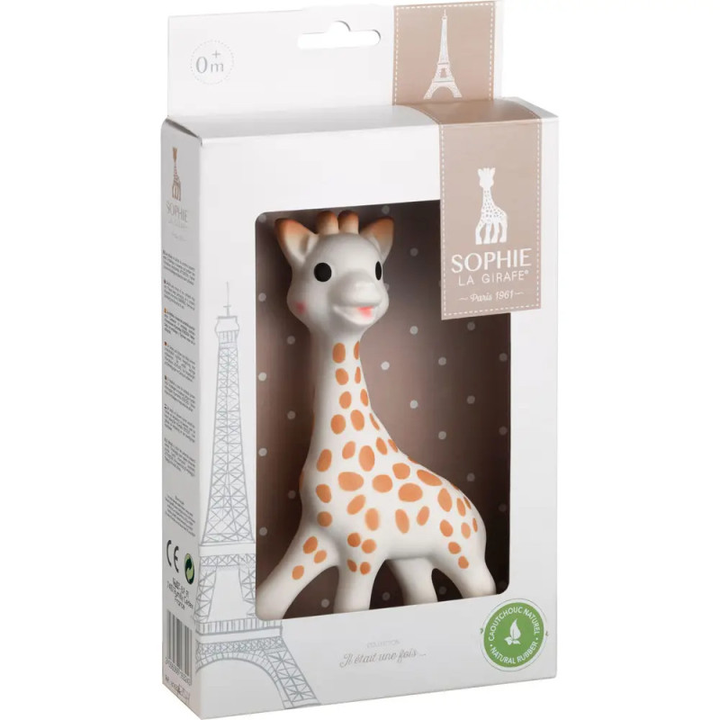Sophie la Girafe Beißspielzeug in weißer Verpackung mit Eiffelturm-Illustration und gepunktetem Hintergrund. Sophie la Girafe Beißspielzeug in weißer Verpackung mit Eiffelturm-Illustration und gepunktetem Hintergrund.