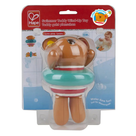 Aufziehbarer Schwimmer-Teddy mit türkisem Schwimmreifen in Verpackung, geeignet ab 12 Monaten. Aufziehbarer Schwimmer-Teddy mit türkisem Schwimmreifen in Verpackung, geeignet ab 12 Monaten.