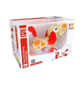 Holz-Hund-Ziehtier mit orangen Punkten in weißer Hape-Verpackung, geeignet ab 12 Monaten.