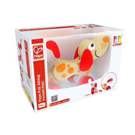 Holz-Hund-Ziehtier mit orangen Punkten in weißer Hape-Verpackung, geeignet ab 12 Monaten. Holz-Hund-Ziehtier mit orangen Punkten in weißer Hape-Verpackung, geeignet ab 12 Monaten.