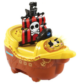 Spielzeug-Piratenschiff mit lächelndem Gesicht und schwarz-rotem Segel mit Totenkopf-Symbol.