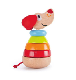 Holz-Stapeltier in Hundeform mit farbigen Ringen in Rot, Orange, Gelb, Blau und Naturholz.