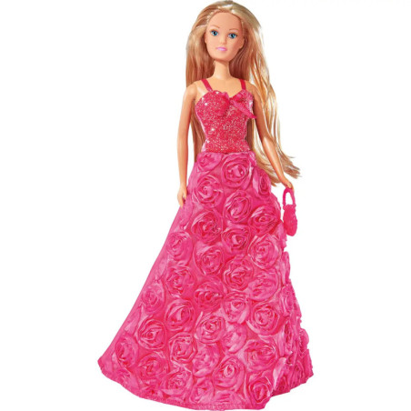 Blonde Puppe im glitzernden rosa Kleid mit Rosenmuster, hält eine passende rosa Handtasche. Blonde Puppe im glitzernden rosa Kleid mit Rosenmuster, hält eine passende rosa Handtasche.